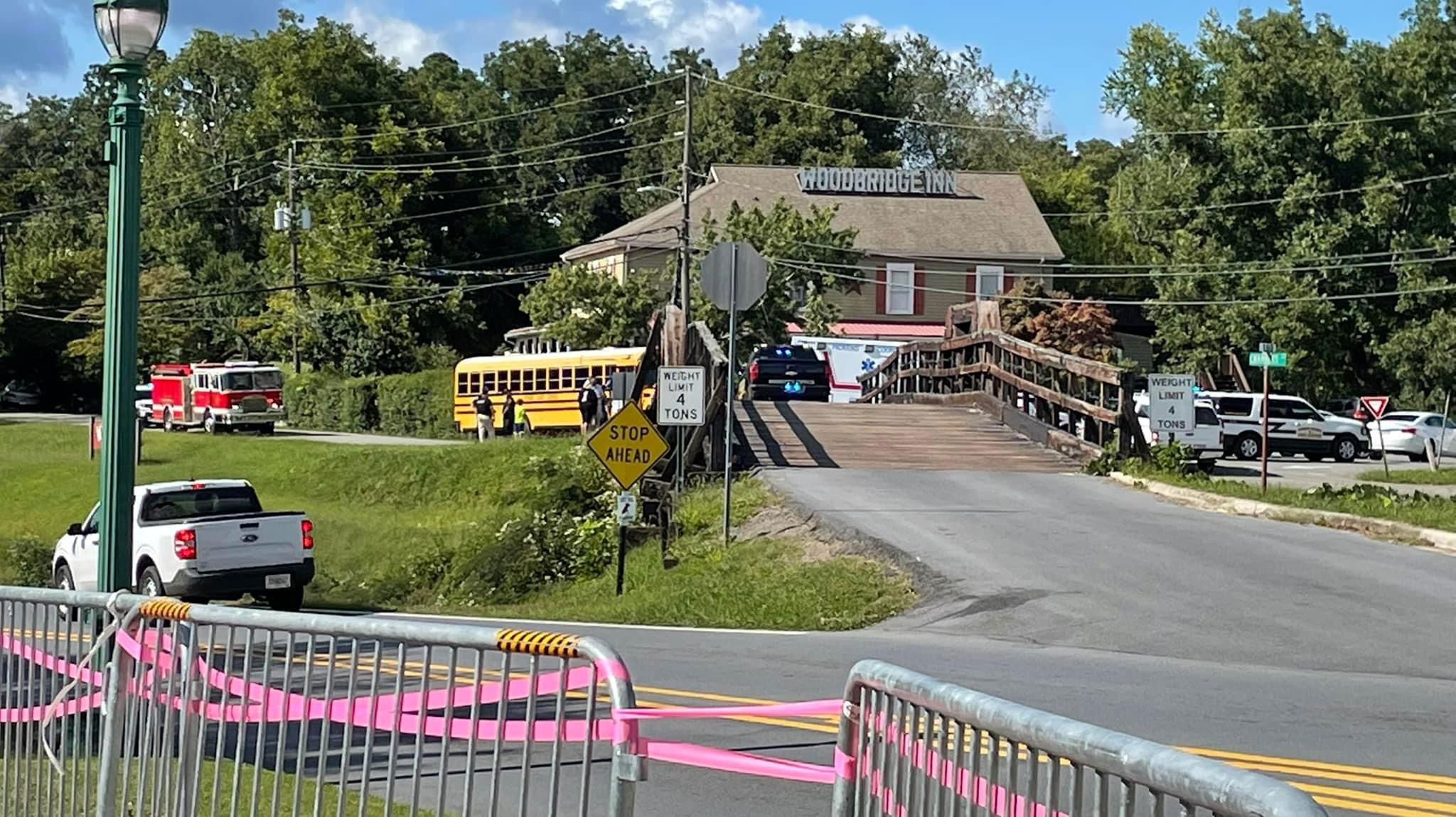 There was a wreck with a bus and a car at the Woodbridge inn