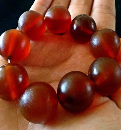 Elephant skin is transformed into red blood beads and sold as jewelry. Photo by Elephant Family