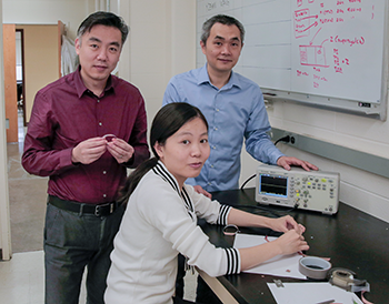 a photo of Xudon Wang, Yin Long, and Hao Wei