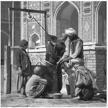 Men gather water from a mosque well. The roles of Afghani men and women differ strongly, both in terms of daily tasks and personal empowerment.