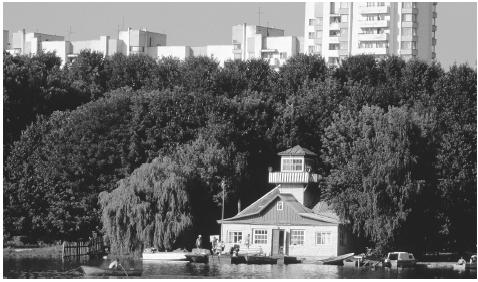 Swimmers and boaters congregate at a bathhouse on the shore of a lake, Minsk. The Baltic Sea and Atlantic Ocean influence the moderate climate.