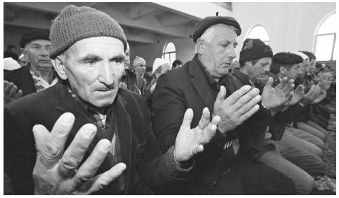 Muslims pray in a mosque on the first day of Bajram in the village of Breznica.