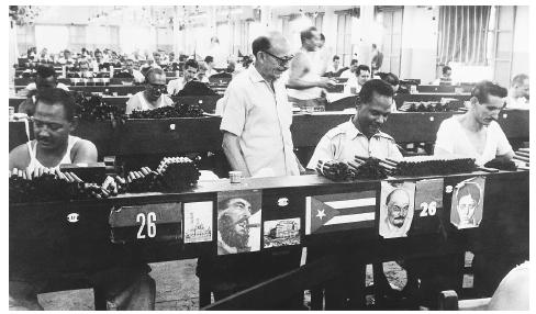 Workers in a cigar factory, Havana. In the socialist system, all workers collectively "own" the factories they work in.