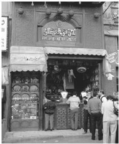 People wait outside a spice shop in Khan el-Khalili. Business queues are often separated by gender.