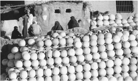 A pile of pottery water jugs in Luxor Village along the Nile River. Irrigation is central to Egyptian agriculture and water is supplied by the government.