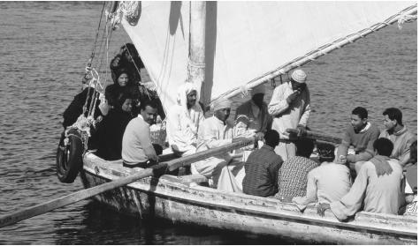 People taking the local ferry in Aswān, Egypt.