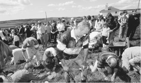 Participants in the International Worm Charming Festival, a charity event held in Devon, England.