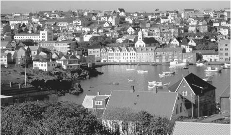 Tórshavn is the principal harbor and capital of the Faroe Islands. Harbors such as this are the hubs of the islands' vital fishing industry.