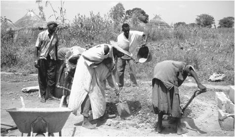 Villagers building a water well. Gambia's dry season runs from November to May.