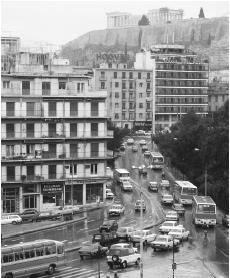 The Parthenon sits above an industrialized Athens, decaying from the exhaust-fouled air.