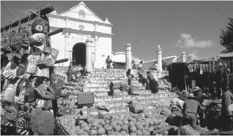 A market set up in front of the church in Chichicastenango, Guatemala. Market-based commerce is still a vital part of the Guatemalan economy.