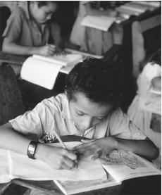 Rural children help with farm chores in addition to their school work.