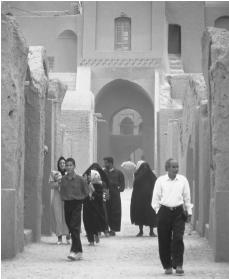 Local Iranian families tour the mud city of Bam to learn of its history.