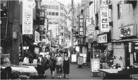 Shoppers indulge in the markets and stores of the Namdaemun shopping district in downtown Seoul, South Korea.