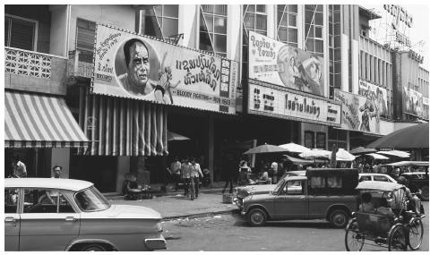 Cars on a busy street. Laos is one of the least urbanized countries in Southeast Asia.