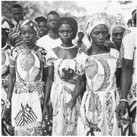 At the Liberia National Commemoration, women wear dresses depicting the Liberian flag and political leaders.