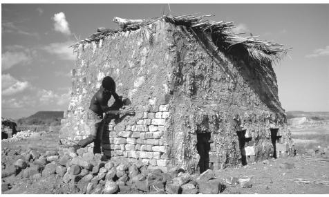 In rural areas people must rely on local materials when building homes and walls. This oven is constructed of mud bricks and a plaster made of hard drying mud.