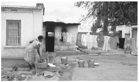 A row of laundry hangs to dry on a washing line in Malawi. Water is obtained from lakes, rivers, and wells and must be carried over great distances.