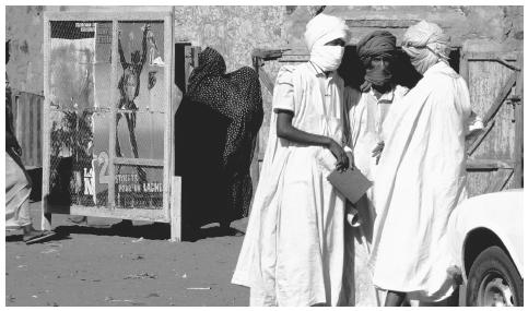 People outside a cinema, Aioun el Atrouss. Open air theater performances are also attended by many people.