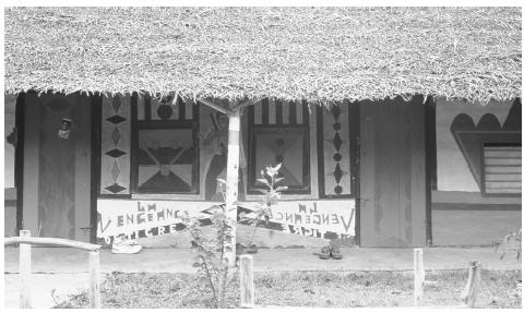 A decorated Banga house. Houses made of earthen brick and cement are encouraged by the government social housing program.