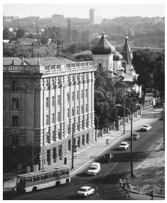 Buildings and a church line a street in Chisinau. The city architecture was mostly constructed by the Russians in the nineteenth century.