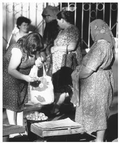 Women at a market in Chisinau. Many Moldovan women work both inside and outside of the home.