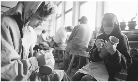 Workers at a ceramic factory in Marginea.