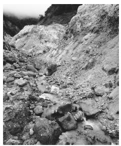 Water cascades over the yellow rocks and soil of the Galway Soufriere volcanic vent. Montserrat depends on Britian for its survival, due to recent volcanic eruptions.