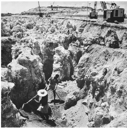 Workers at a phosphate mine in Nauru. Phosphate revenues are the mainstay of the economy, however, the interior four-fifths of the island has been mined out.