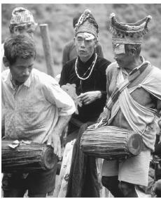 Nepalese men in a wedding ceremony; arranged marriages are the norm in mainstream culture.