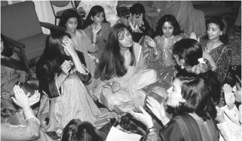 Women gathered together at a wedding in Islamabad. Muslim marriages unite not only a couple but also their families.