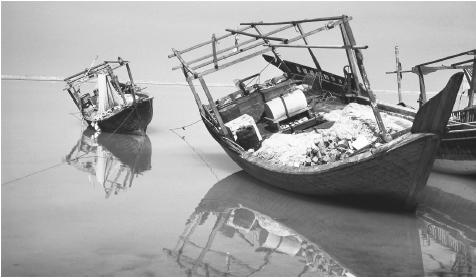 Fishing boats off the coast of Qatar. Seafood is a central part of Qatar's cuisine.