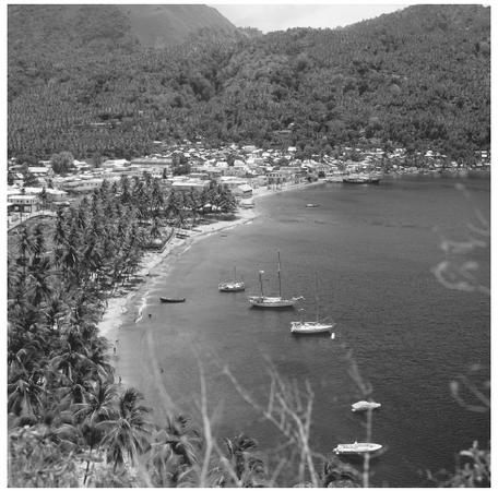 Boats in a cove in Sonfiere. Many original settlements began as fishing villages.