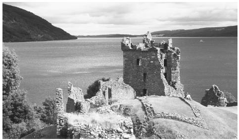 A castle overlooks the water in Scotland. Castles dot the countryside in all parts of the United Kingdom.