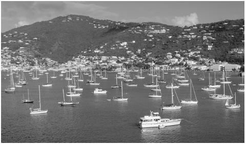 Boats in the Charlotte Amalie Harbor, Saint Thomas. Two million tourists visit the islands annually; two-thirds of them are cruiseship passengers.