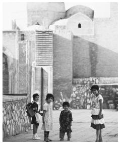 Children walking home after school. As children grow older, school discipline increases.