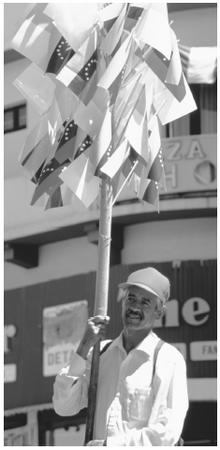 A peddler selling Venezuelan flags. Statues of freedom-fighter Simón Bolívar are pervasive throughout the country.