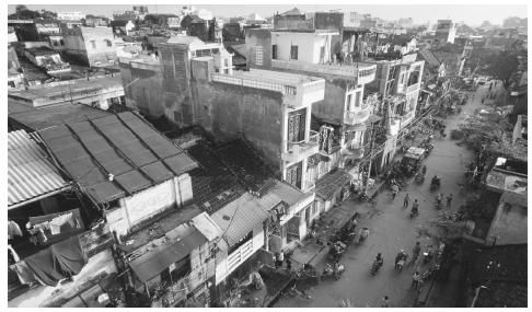 Overview of Hanoi's Old Quarter. The French colonial influence is apparent in the architecture of many of the buildings that line the street.