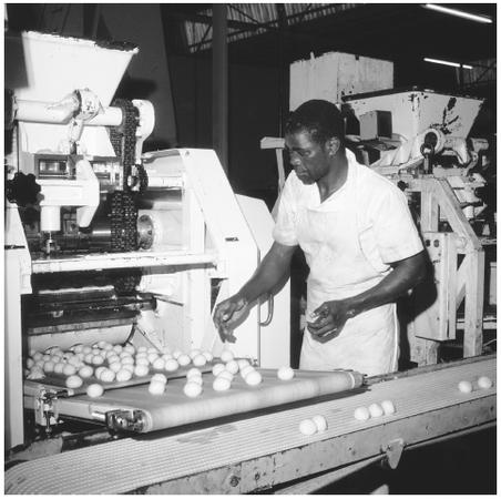 A man working at a food processing plant at Kabwe. Industrial jobs are scarce, as few products are produced in Zambia. Only 12 percent of the working population is employed in industry.