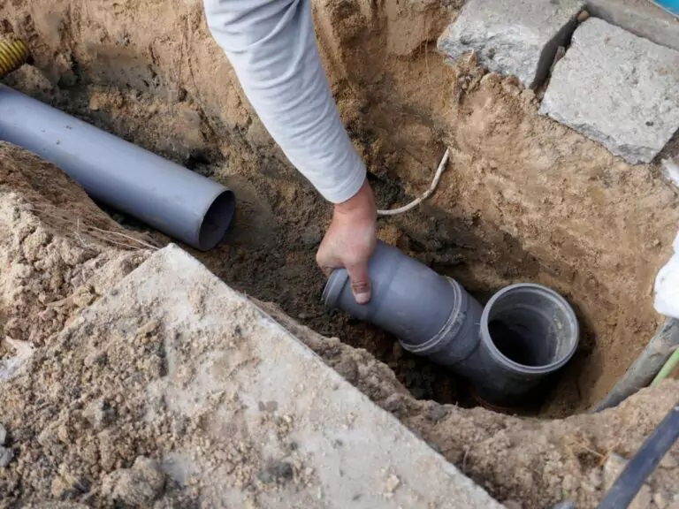 Plumber Solving Drainage Problem