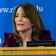 Head shot of woman speaking from a podium