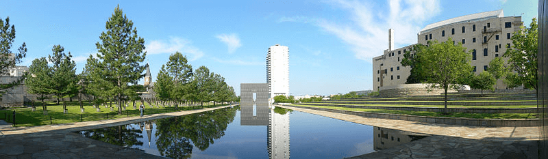 A panoramic view of the memorial. In the center is a large stone structure shaped as a gate with 