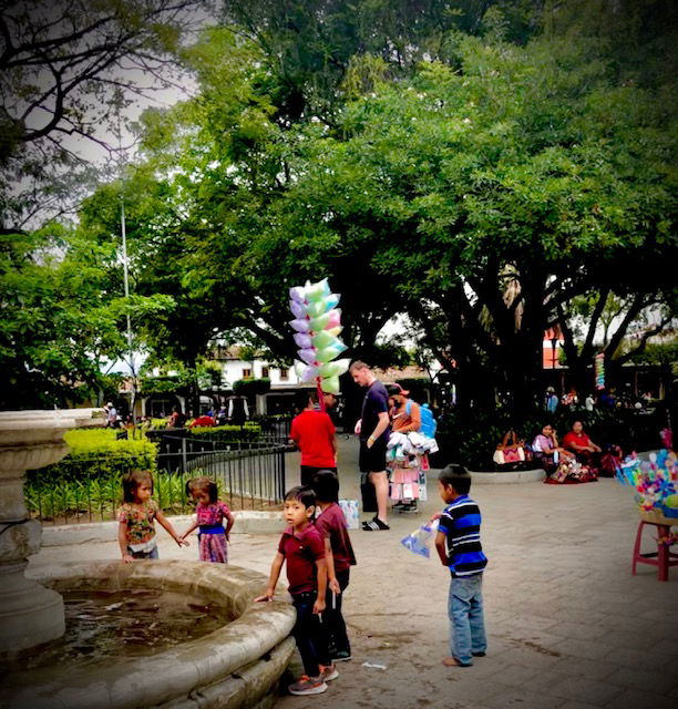 The little Mayan girls were splashing eachother and putting mud in eachother's hair