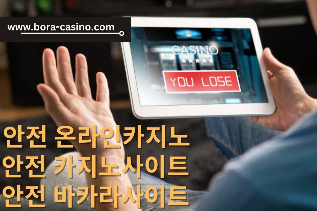 Man holding his white tablet in right while his left hand raised because he lose his online casino game.