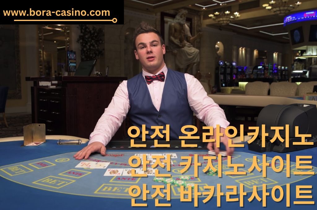 Handsome Live Dealer seating in front of table game for live casino game.