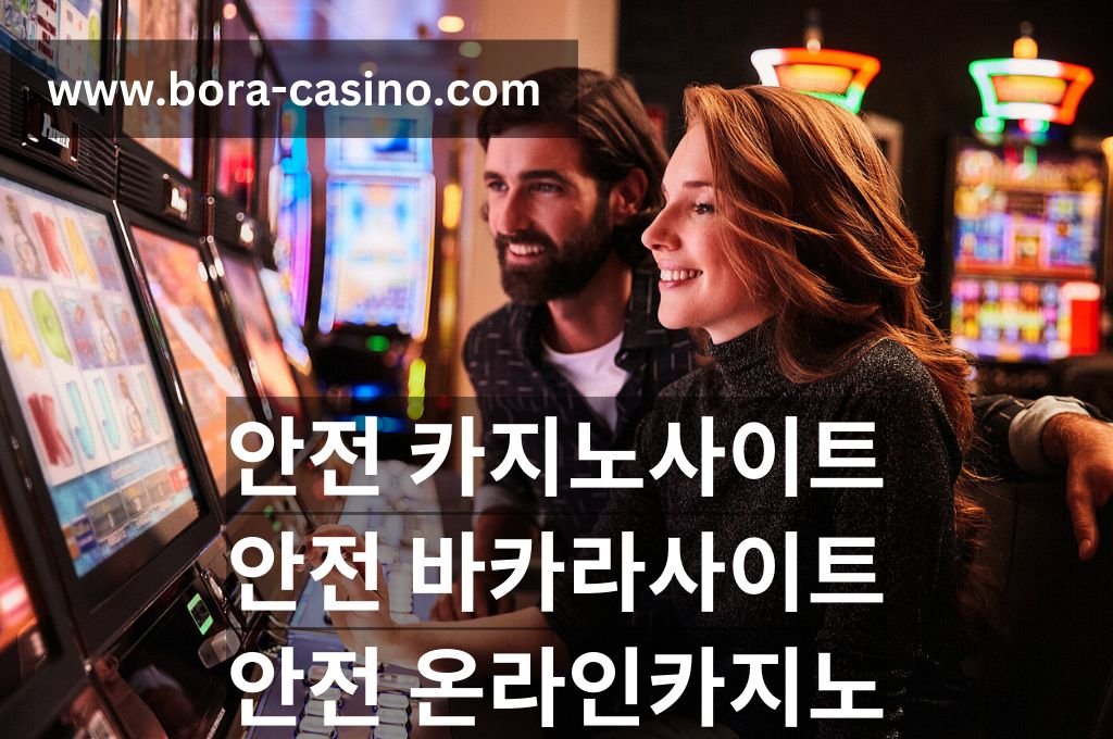 Beautiful couple playing penny gambling machine in casino.