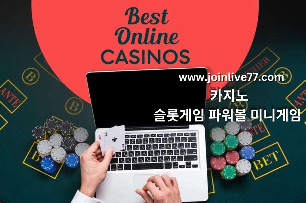 Best online casino, casino table with casino chips, laptop and a hand of man holding a cards