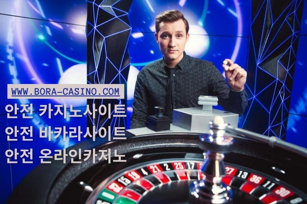 Casino dealer holding a double ball that he will spin on roulette wheel