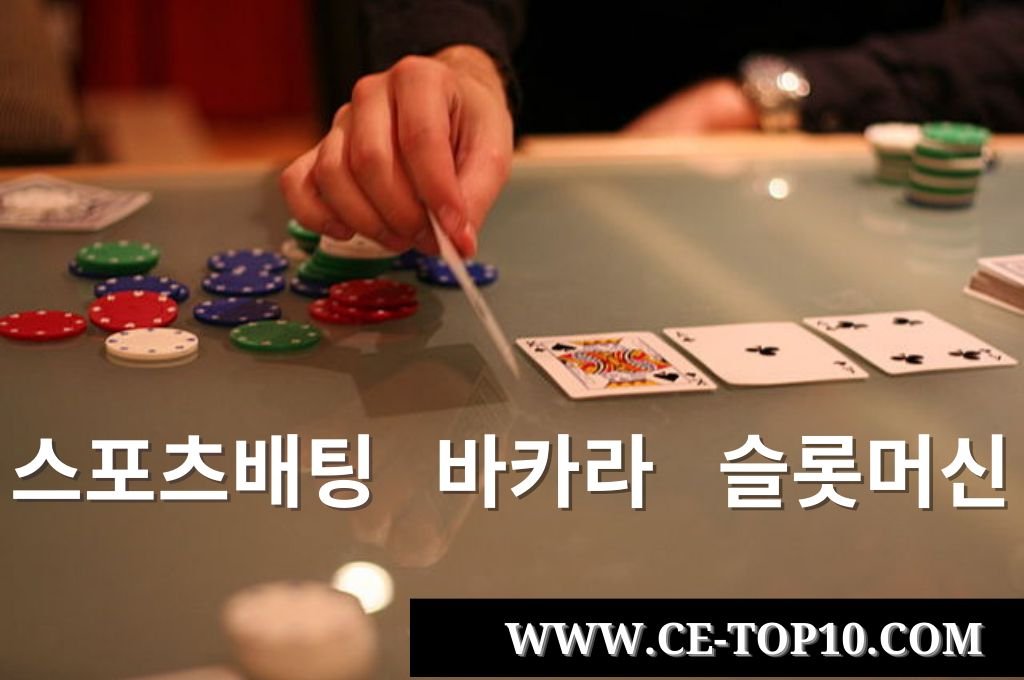 Poker chips and cards hold by a hand in the glass table game.