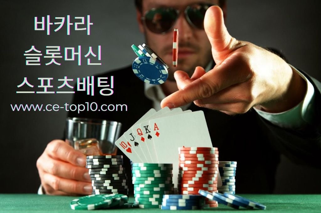 Gambler expert throw a poker chips while holding a glass of alcohol,  poker chips and cards on the table